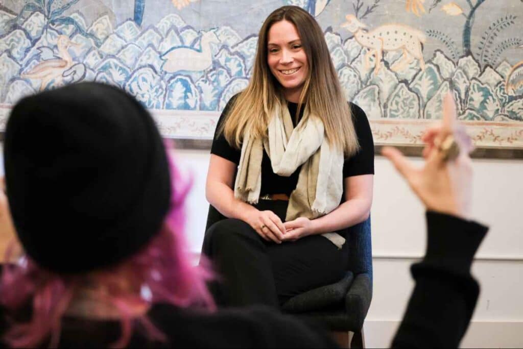 Alicia Martin, LMSW facilitating Healing in Connection, a women's trauma and ketamine therapy group at Acheron Psychiatry.