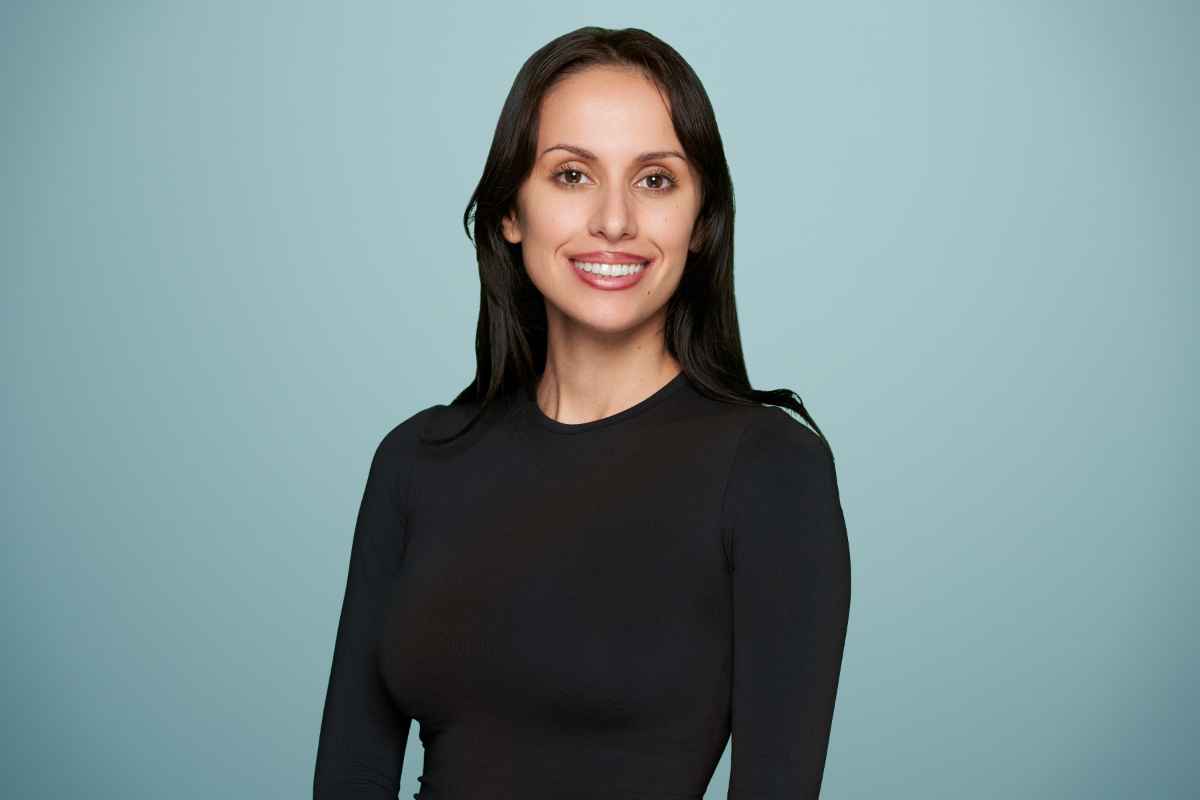 Sydney Loera smiles at Acheron Psychiatry.