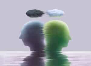 Abstract illustration of two human silhouettes with dark and light clouds symbolizing bipolar mood shifts.