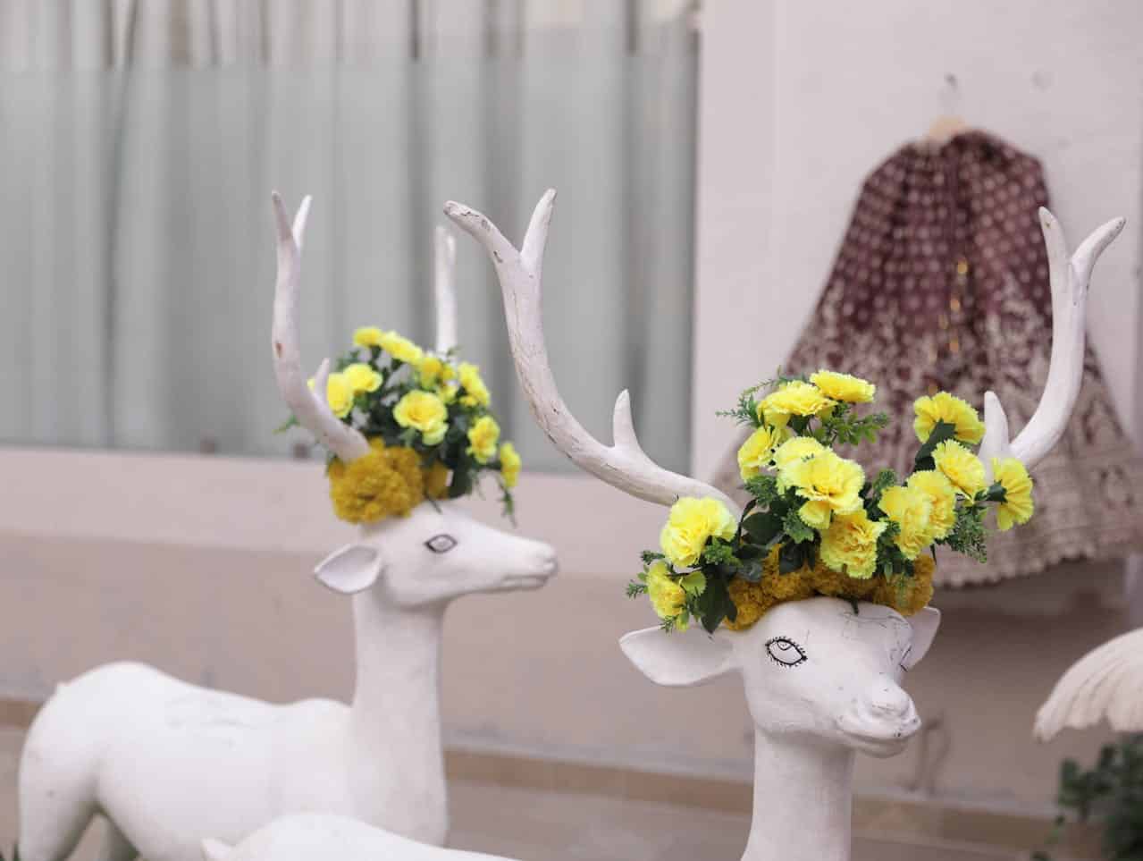Decorative deer with floral crowns representing self acceptance and freedom from comparison